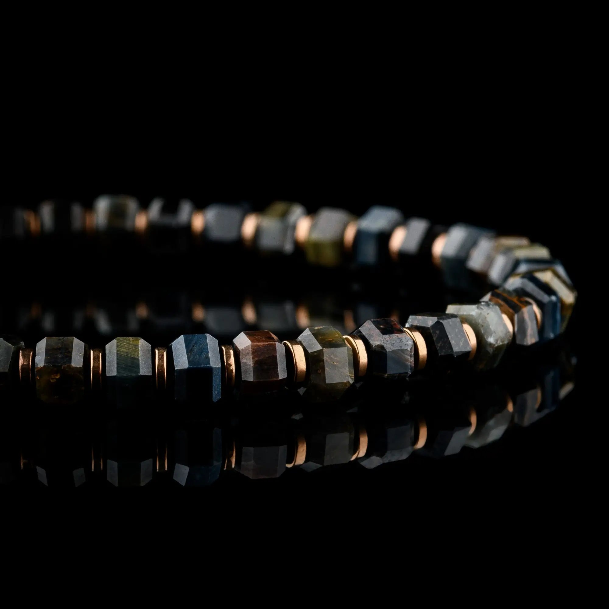 Detail of blue tiger eye bracelet for men. Hawk's Eye chatoyant band on hexagon beads. Aurum Brothers.